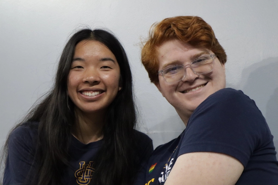 Girl and boy smiling.
