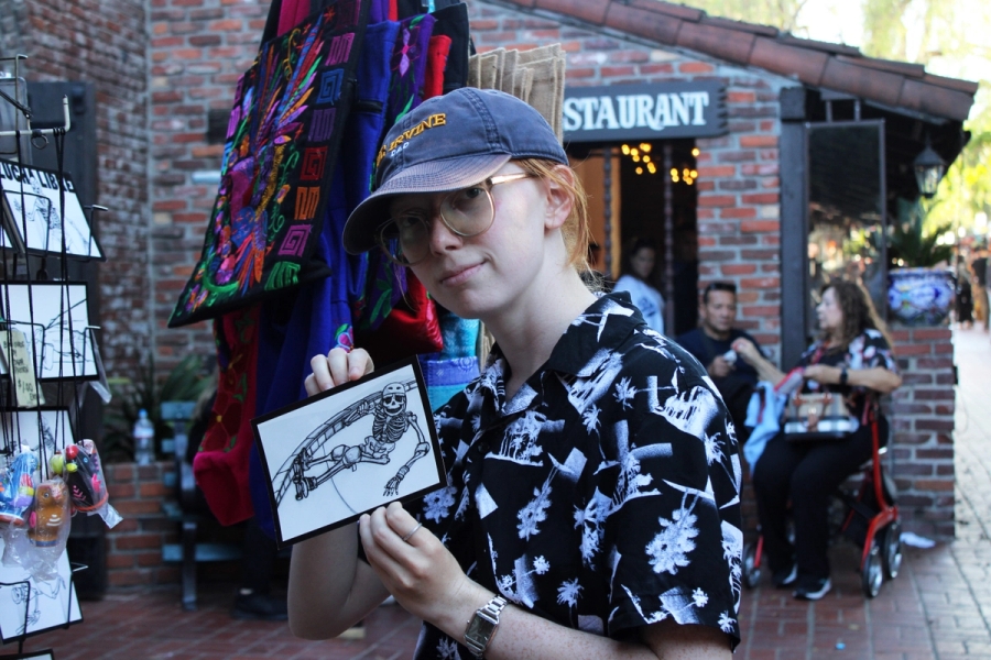 Girl posing with postcard.