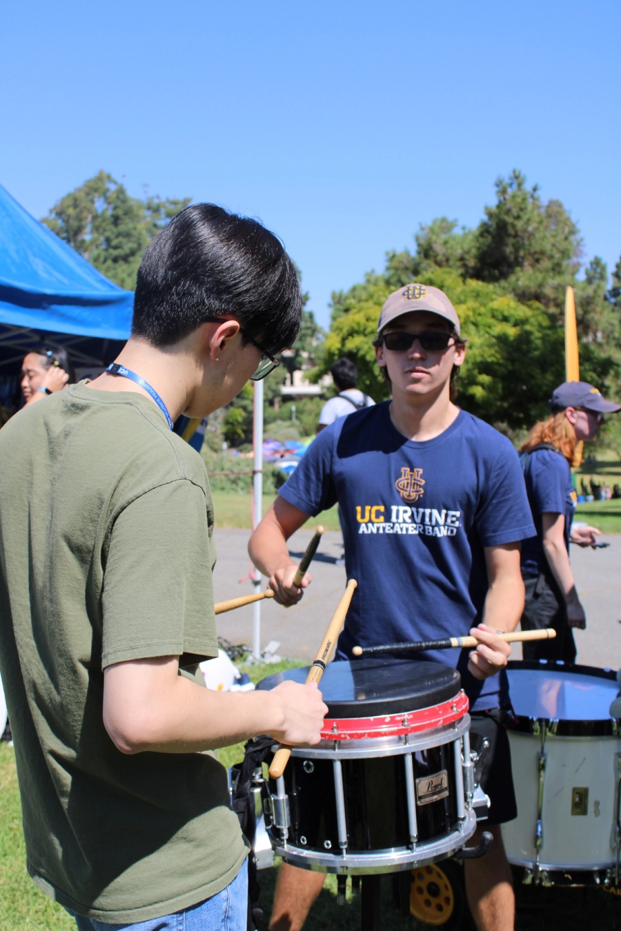Playing drums with a prospective student.
