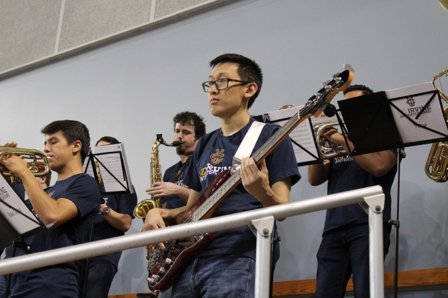 Man playing bass and staring at court.