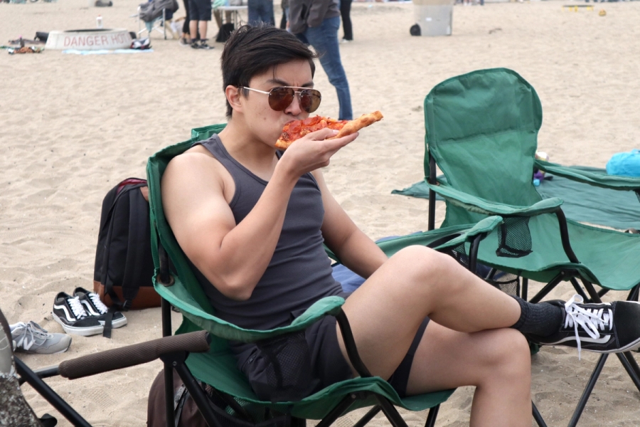 Boy eating a pizza.