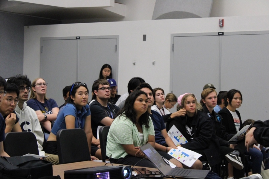 New and returning members listening attentively to the presentation.