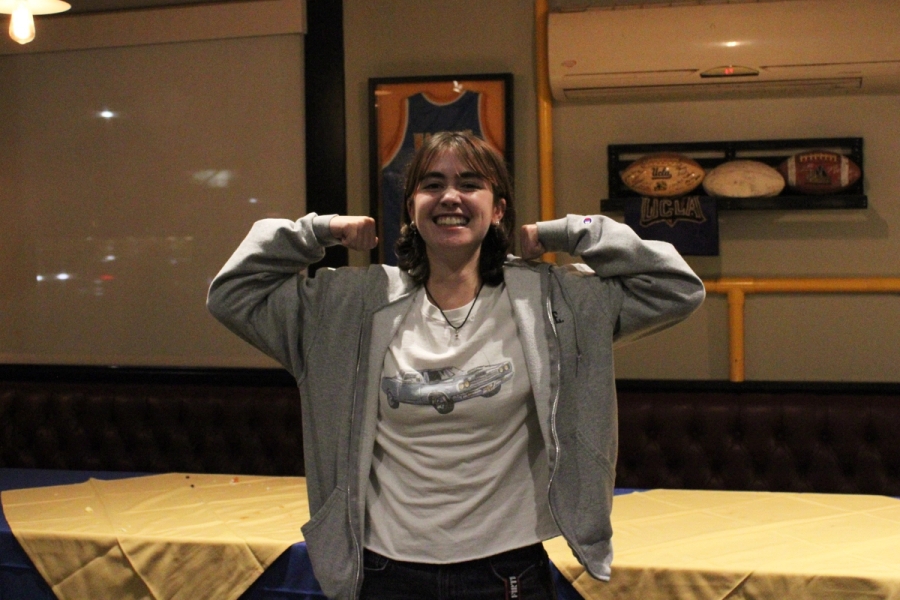 Girl flexing her arms.