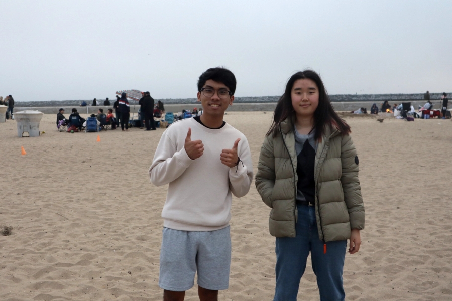 A boy and a girl smiling.