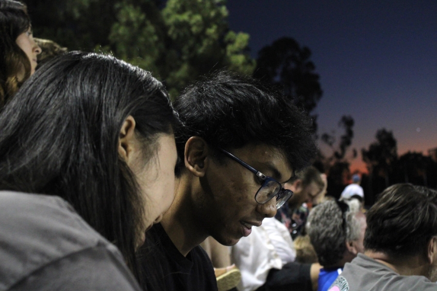 Boy and girl staring down.