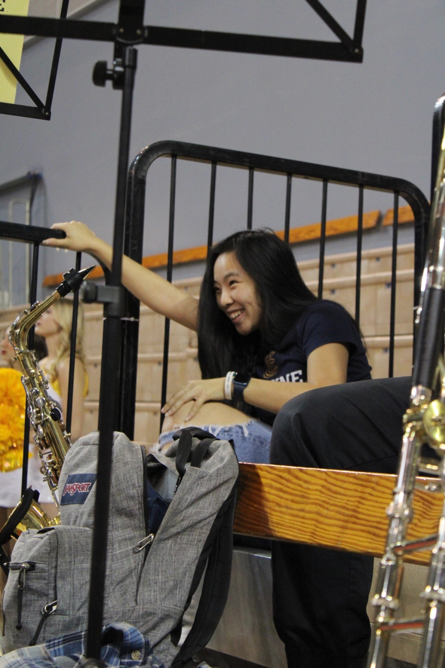 Alto sax girl trying to stand up.