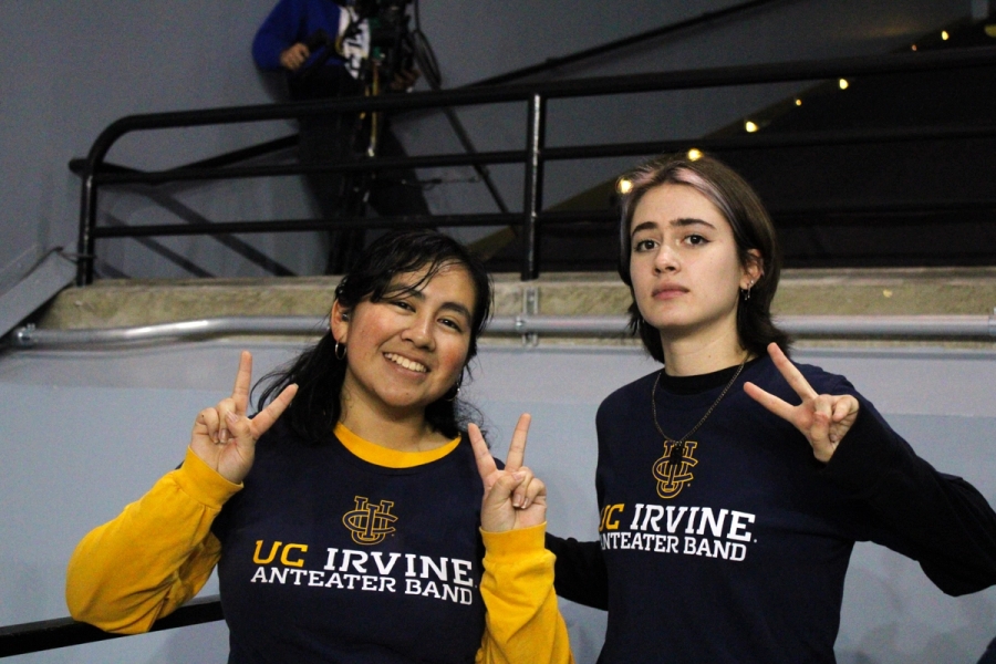 Two girls with peace signs.