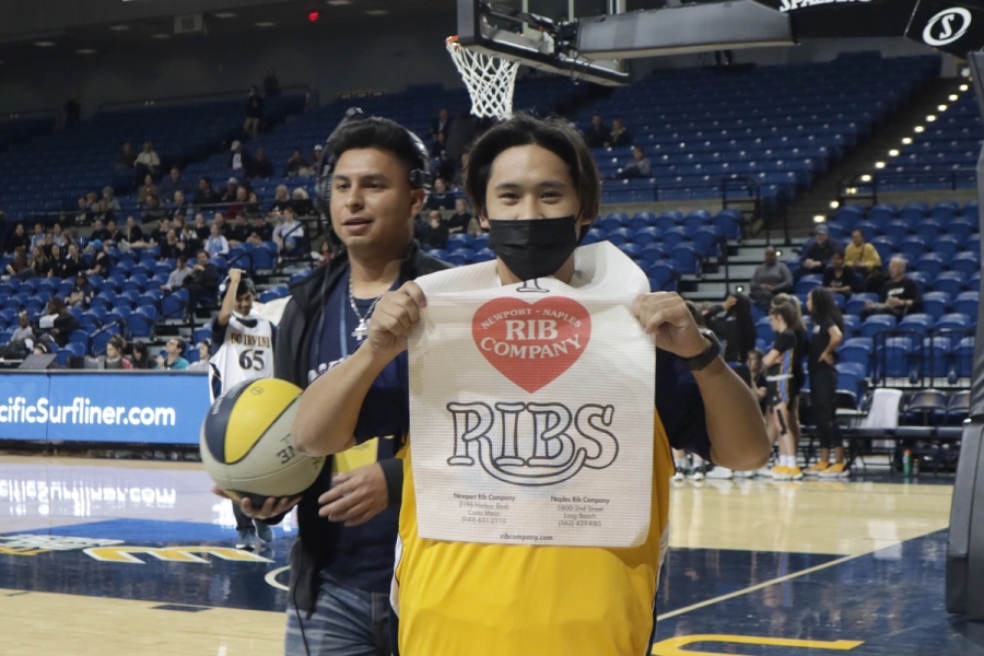 Boy with mask shows off bib.