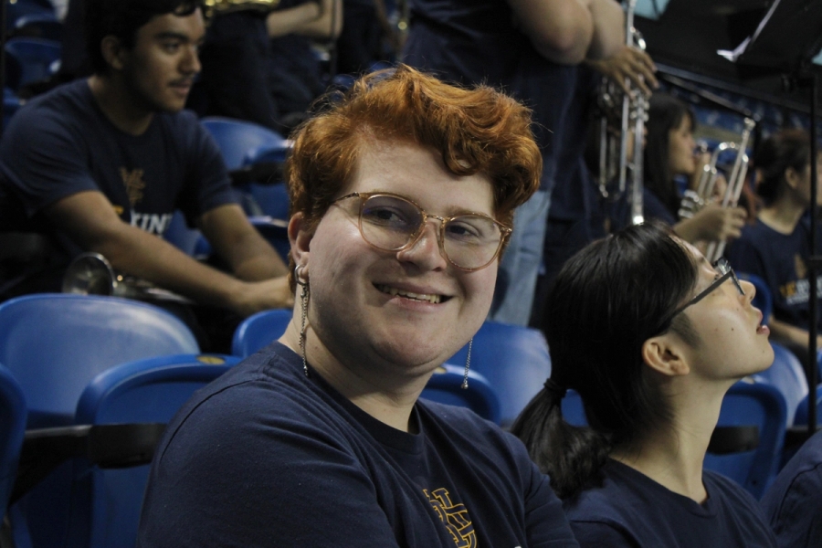 Boy smiles at camera.