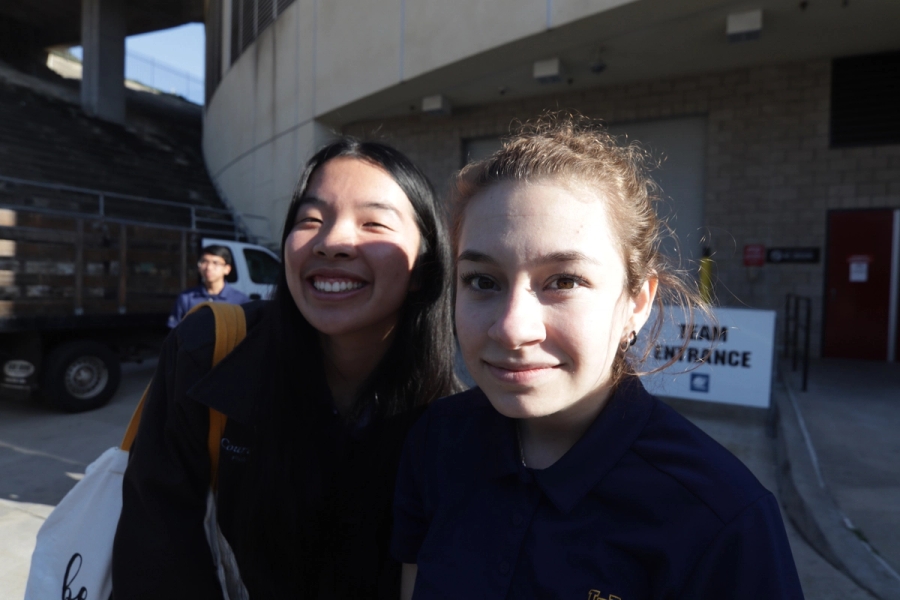 Two girls smiling in the sun.