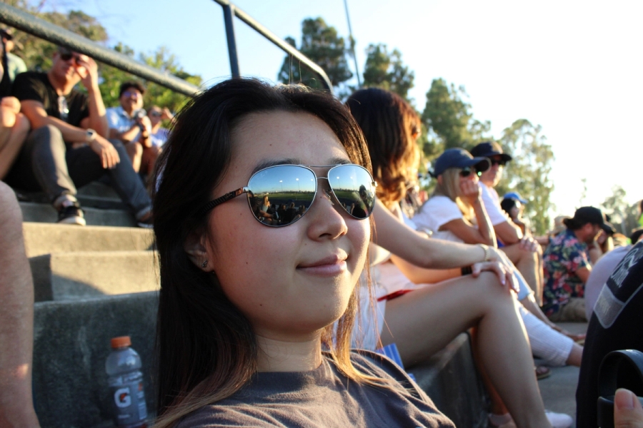 Girl with shades looking at camera.