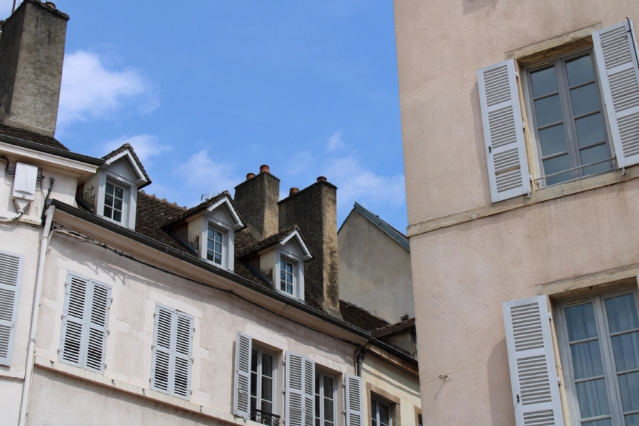 Low POV of two buildings.