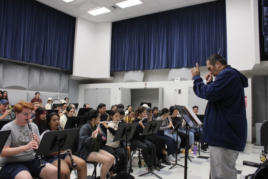 Low POV of director conducting.