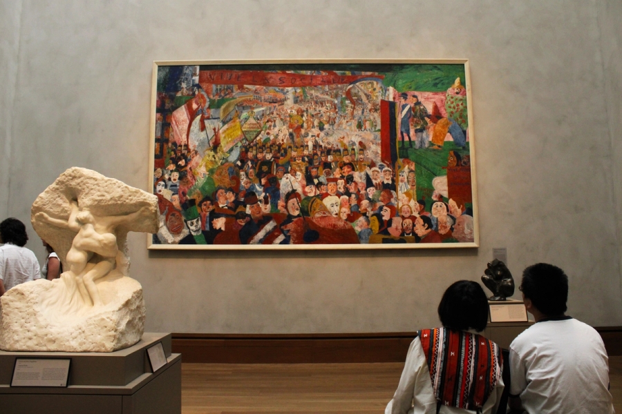 Two people admiring an art piece.