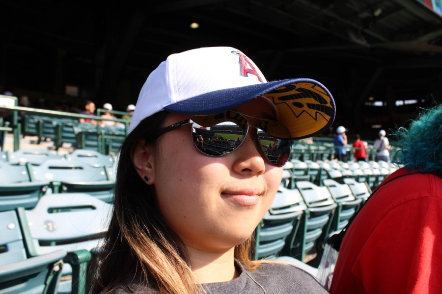 Girl in shades with hat.