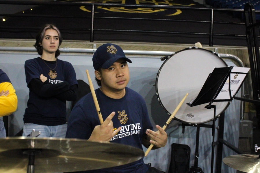 Boy on drums with peace signs.