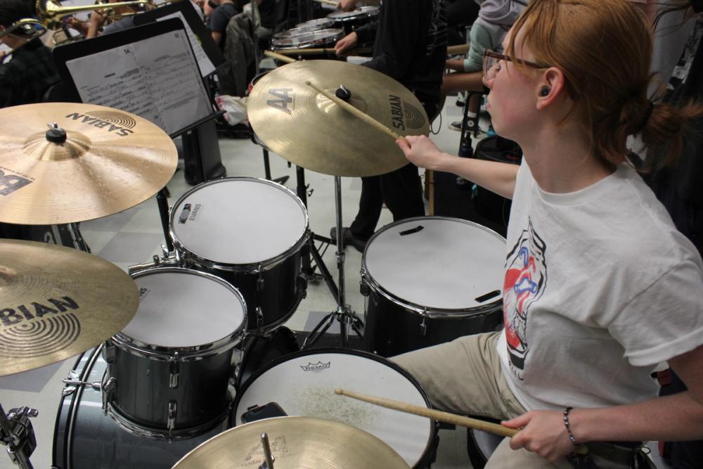 Girl playing the drums.