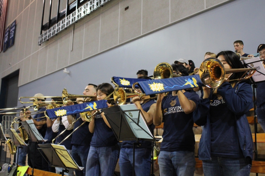 Low POV of trombones playing.