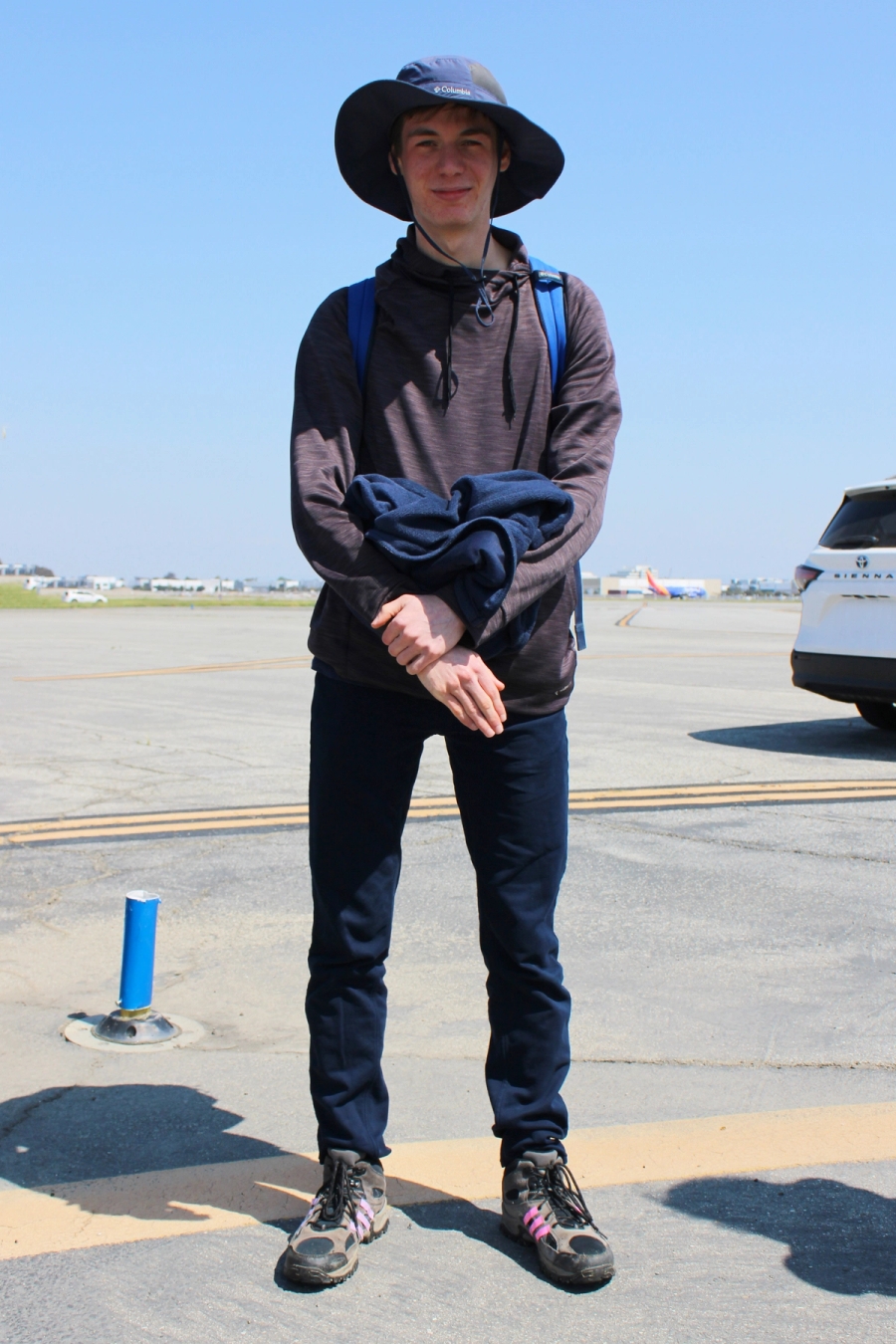 Boy showing his full fit.