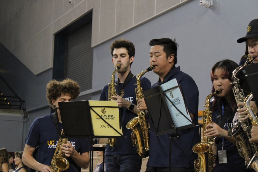 Three alto sax guys playing.