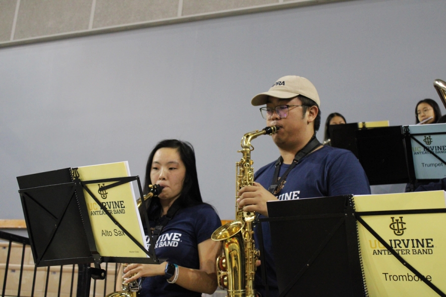 Boy and girl playing the alto sax.