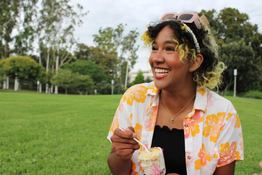 Girl laughing facing left.