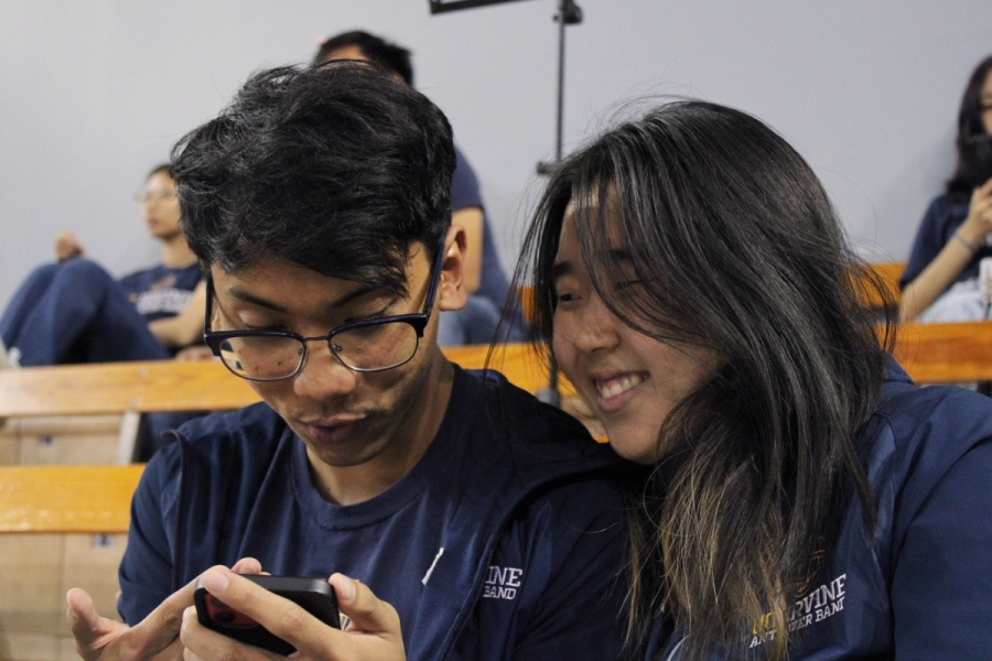 Boy and girl looking at phone.