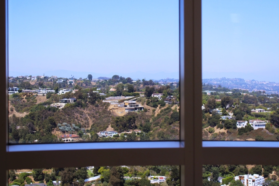 View of hill through window.