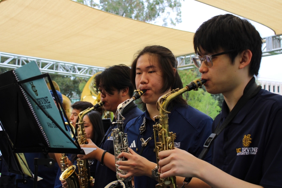 Side POV of alto saxes playing.