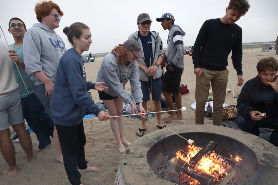 Group of people around a campfire.