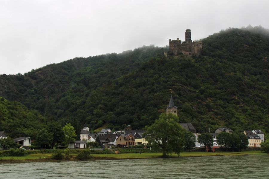 Castle on the hill and village at the bottom.