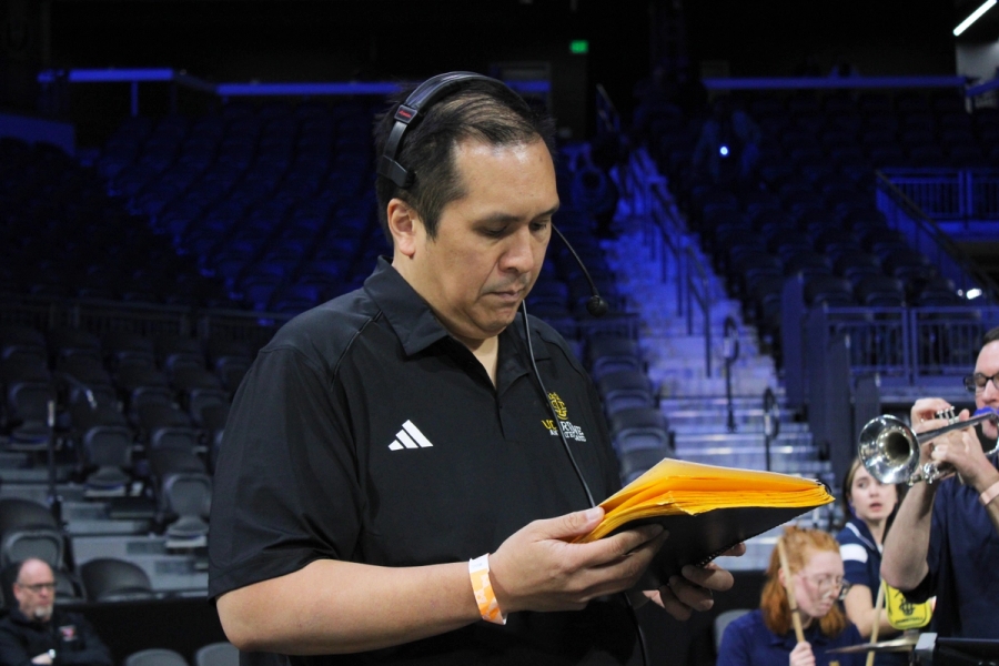 Band director looking at setlist.