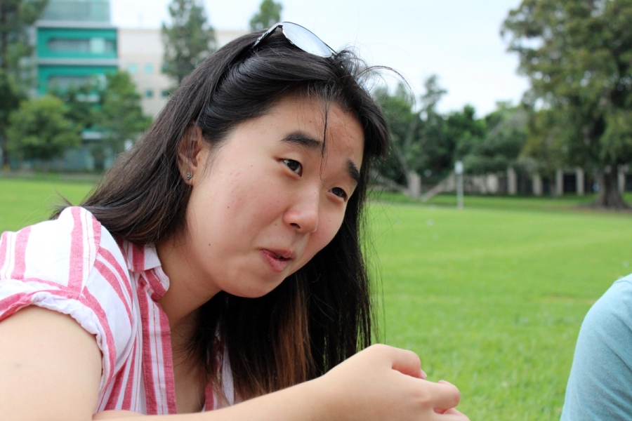 Asian girl looks concerned.