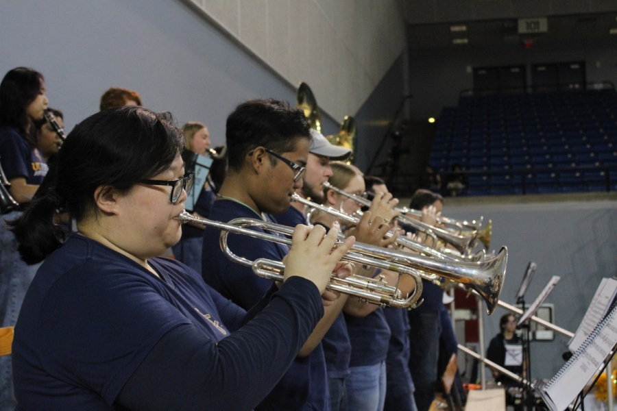Side POV of trumpets playing.