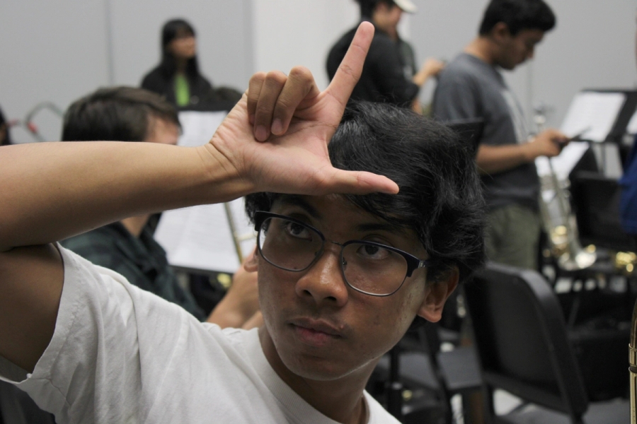 Boy with an 'L' on his forehead.