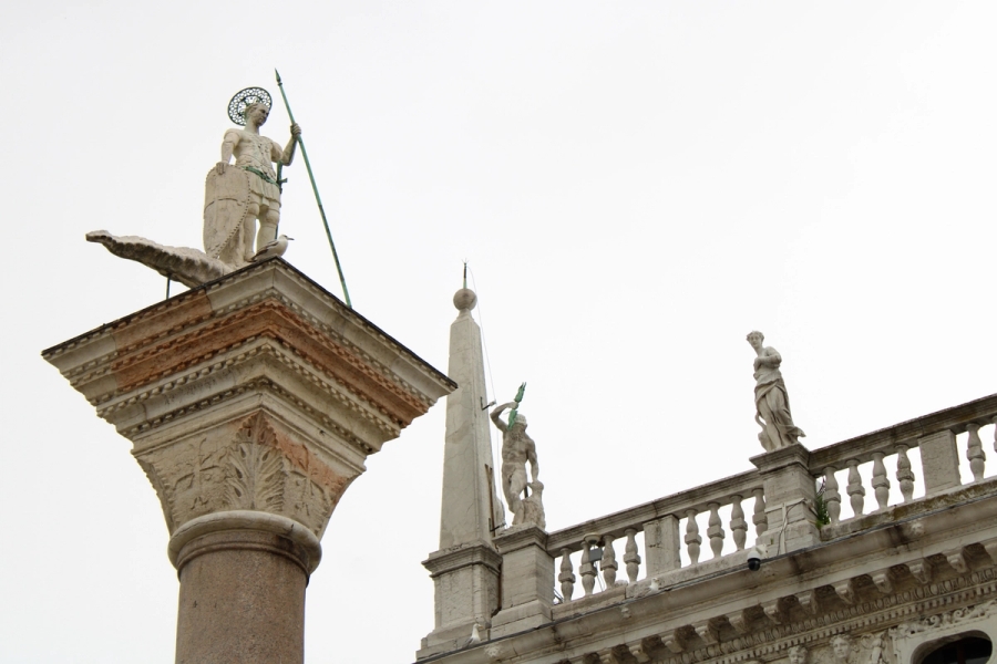 Low POV of three different statues.