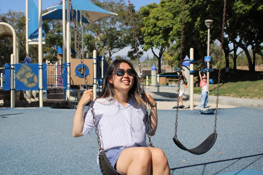 Girl swinging.