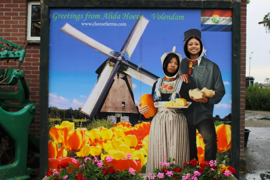 Two girls in postcard cutout.