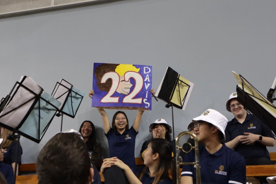 Girl holding #22 sign.