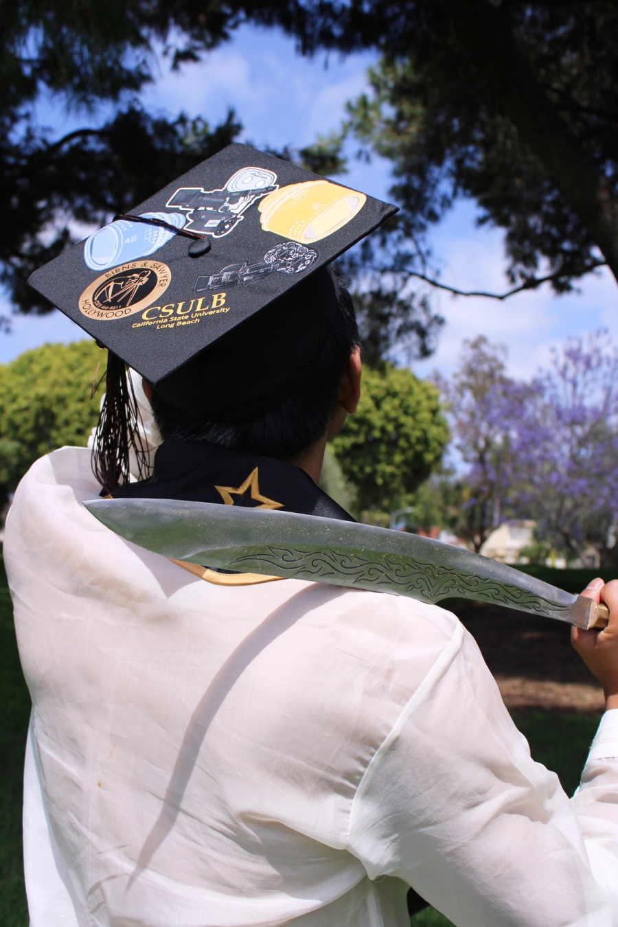 Grad cap and medium sword.