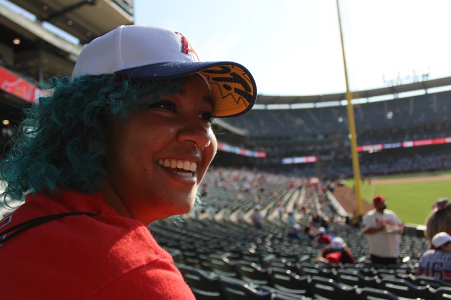Girl smiling with hat.