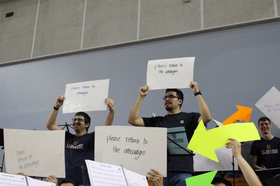 Members showing the backs of the signs.