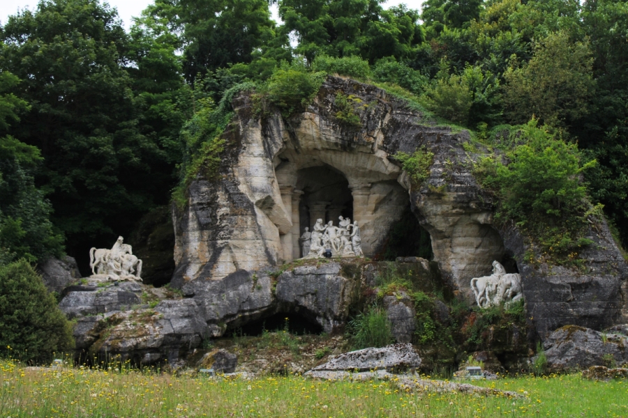 Statues in rock openings.
