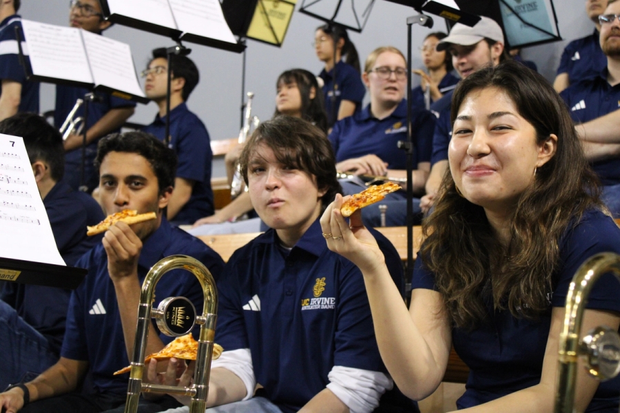 Three trombones eating pizza.