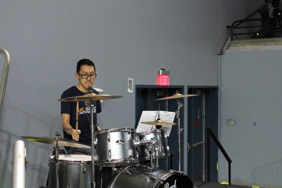 Man playing on drums.