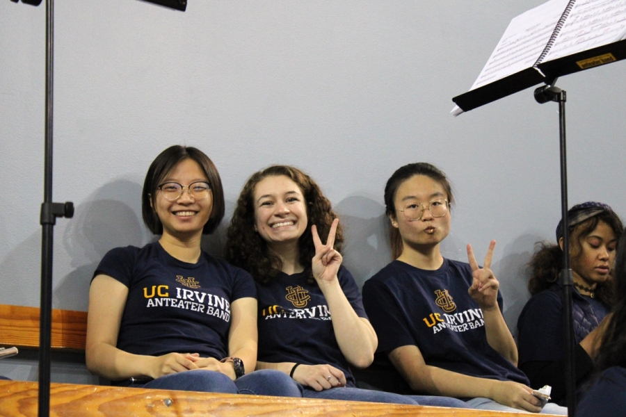 Three flutes holding up peace signs.