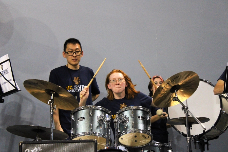 Girl drumming crazy.