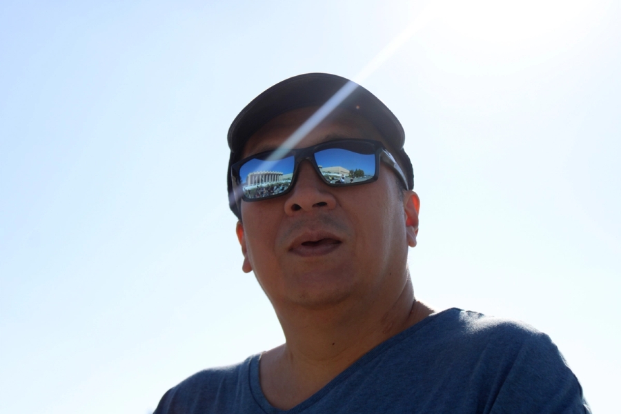 Low angle POV of man in shades.