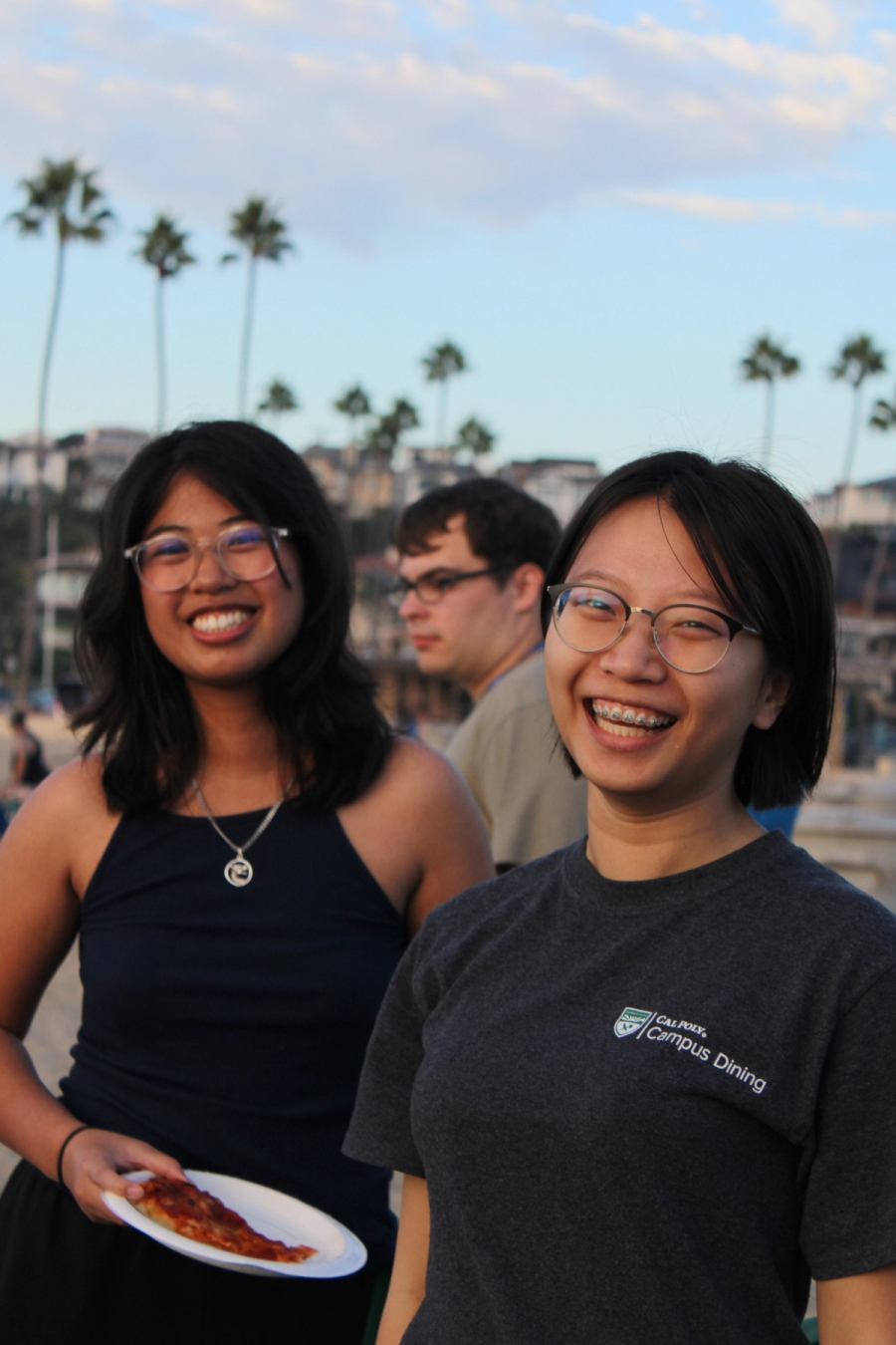 Two girls smiling at camera.