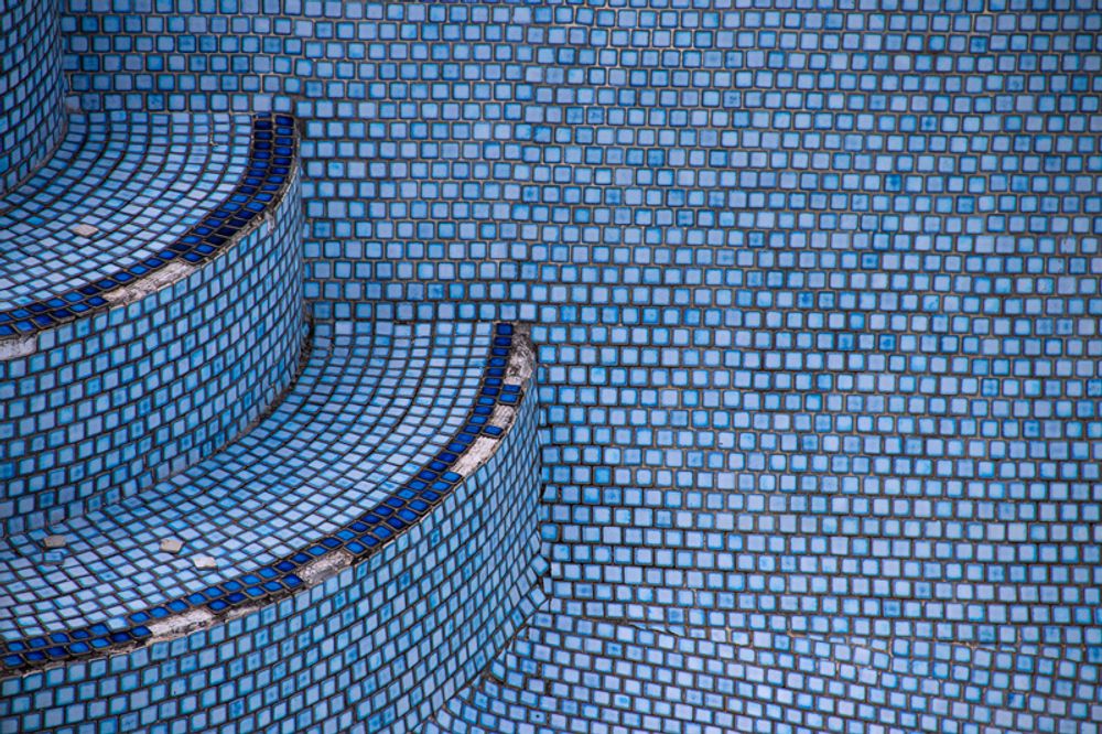 Stairs of an emptied out pool.
